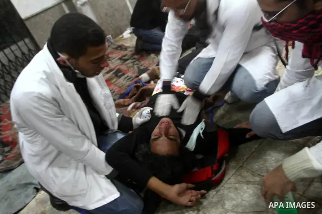 Egyptian protesters clash with riot police in a Cairo street on November 22, 2011. Thousands of protesters swarmed Cairo's Tahrir Square to demand an end to military rule, heightening tension after days of deadly clashes...