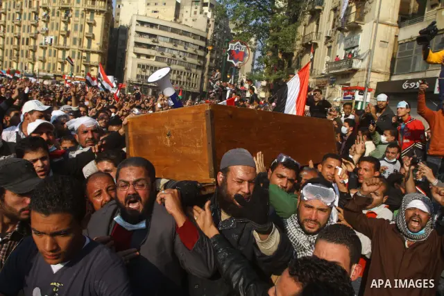 Protesters in Tahrir Square attend a funeral carrying the coffin of a protester who died in clashes with riot police. Egyptians frustrated with military rule battled police in the streets again on Tuesday as the generals...