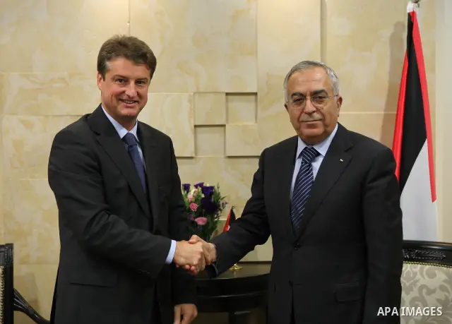 Palestinian Prime Minister, Salam Fayyad, receives Development and Cooperation Minister Belgian, Oliver Shastel, in the West Bank City of Ramallah on Nov. 22, 2011. Photo by Mustafa Abu Dayeh