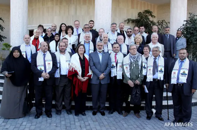 Palestinian Prime Minister in Gaza Strip, Ismail Haniyeh meets with the members of the spring of freedom convoy at his office in Gaza city on Nov. 23, 2011. A convoy carrying Arab, European and International activists vi...