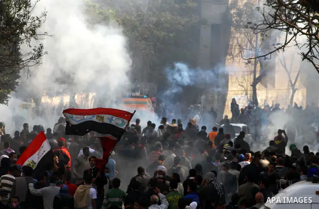 Egyptian protestors clash with riot police, not pictured, near Tahrir square in Cairo, Egypt, Wednesday, Nov. 23, 2011. Egyptian police are clashing with anti-government protesters for a fifth day in Cairo. Tens of thous...