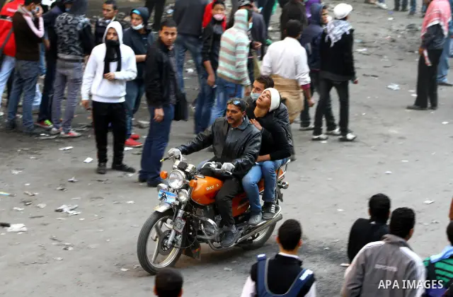 Egyptian protestors clash with riot police, not pictured, near Tahrir square in Cairo, Egypt, Wednesday, Nov. 23, 2011. Egyptian police are clashing with anti-government protesters for a fifth day in Cairo. Tens of thous...