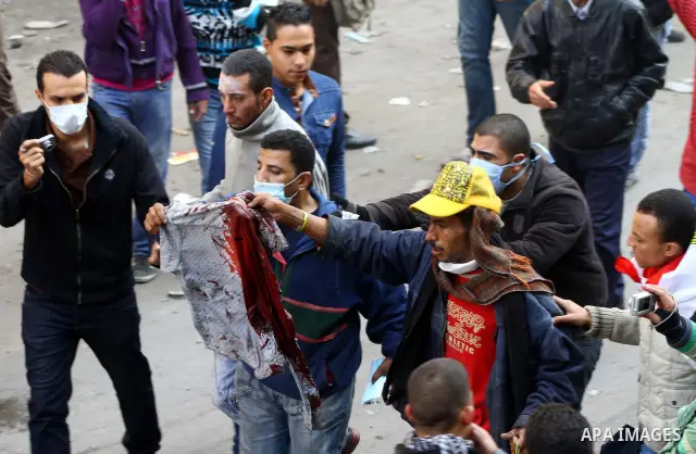 Egyptian protestors clash with riot police, not pictured, near Tahrir square in Cairo, Egypt, Wednesday, Nov. 23, 2011. Egyptian police are clashing with anti-government protesters for a fifth day in Cairo. Tens of thous...