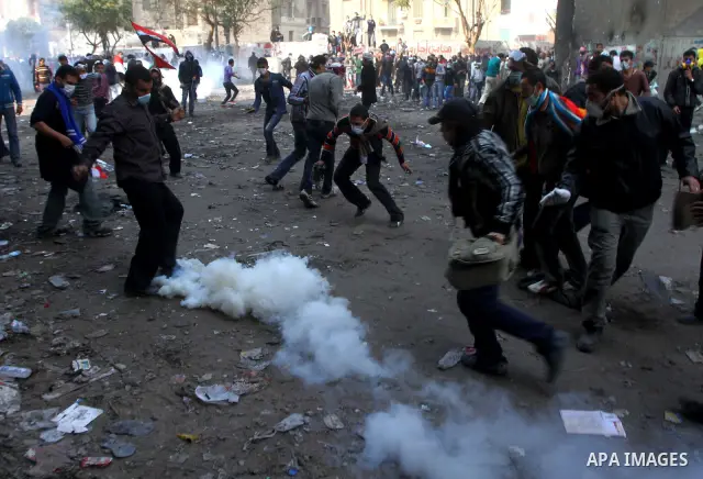 Egyptian protestors clash with riot police, not pictured, near Tahrir square in Cairo, Egypt, Wednesday, Nov. 23, 2011. Egyptian police are clashing with anti-government protesters for a fifth day in Cairo. Tens of thous...