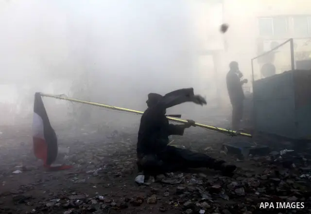 Egyptian protestors clash with riot police, not pictured, near Tahrir square in Cairo, Egypt, Wednesday, Nov. 23, 2011. Egyptian police are clashing with anti-government protesters for a fifth day in Cairo. Tens of thous...