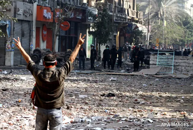 Egyptian riot police clash with protestors near Tahrir square in Cairo, Egypt, Wednesday, Nov. 23, 2011. Egyptian police are clashing with anti-government protesters for a fifth day in Cairo. Tens of thousands of protest...