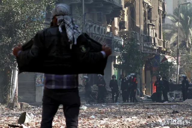 Egyptian riot police clash with protestors near Tahrir square in Cairo, Egypt, Wednesday, Nov. 23, 2011. Egyptian police are clashing with anti-government protesters for a fifth day in Cairo. Tens of thousands of protest...