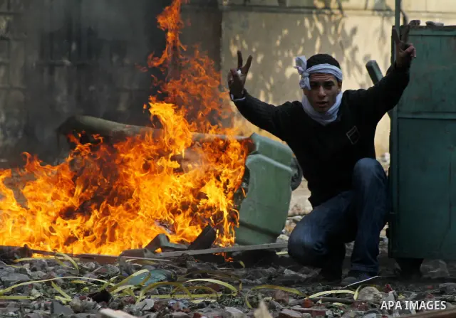 Egyptian protestors clash with riot police, not pictured, near Tahrir square in Cairo, Egypt, Wednesday, Nov. 23, 2011. Egyptian police are clashing with anti-government protesters for a fifth day in Cairo. Tens of thous...