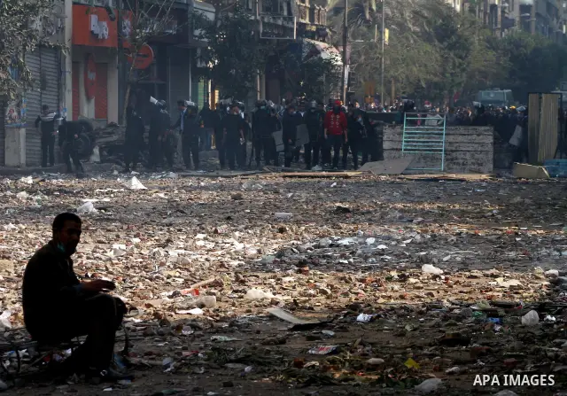 Egyptian riot police clash with protestors near Tahrir square in Cairo, Egypt, Wednesday, Nov. 23, 2011. Egyptian police are clashing with anti-government protesters for a fifth day in Cairo. Tens of thousands of protest...