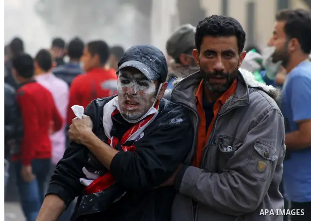 Egyptian protestors clash with riot police, not pictured, near Tahrir square in Cairo, Egypt, Wednesday, Nov. 23, 2011. Egyptian police are clashing with anti-government protesters for a fifth day in Cairo. Tens of thous...