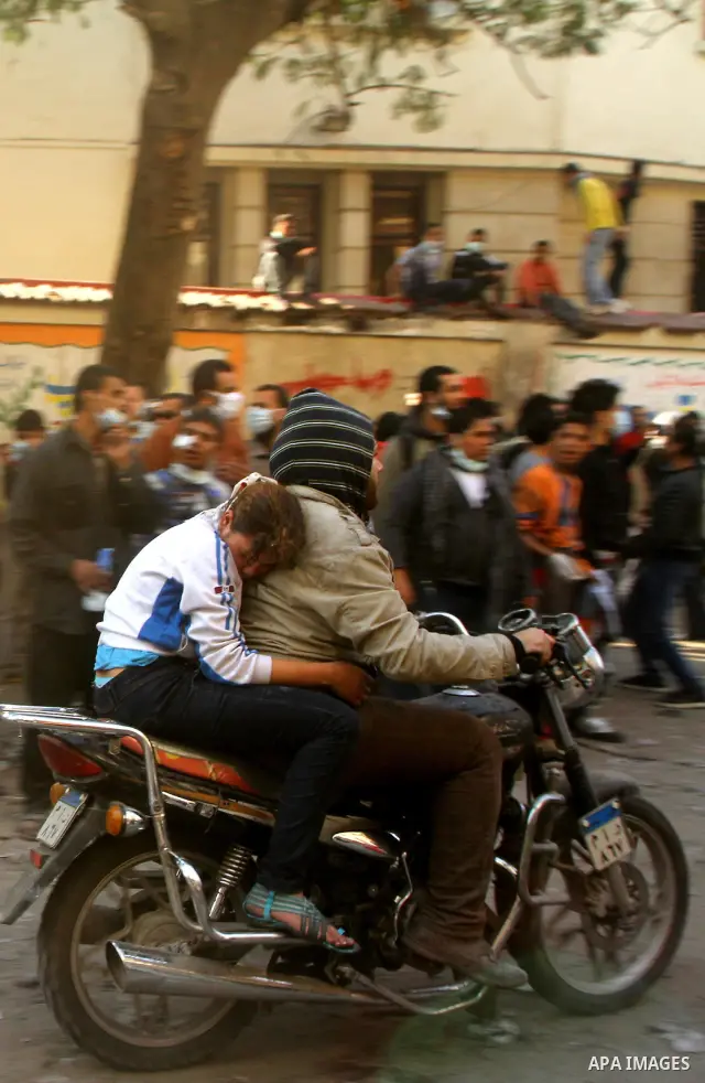 Egyptian protestors clash with riot police, not pictured, near Tahrir square in Cairo, Egypt, Wednesday, Nov. 23, 2011. Egyptian police are clashing with anti-government protesters for a fifth day in Cairo. Tens of thous...