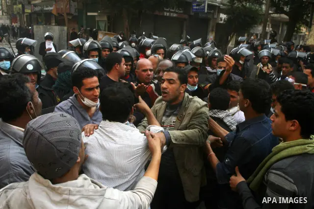 Egyptian riot police clash with protestors near Tahrir square in Cairo, Egypt, Wednesday, Nov. 23, 2011. Egyptian police are clashing with anti-government protesters for a fifth day in Cairo. Tens of thousands of protest...