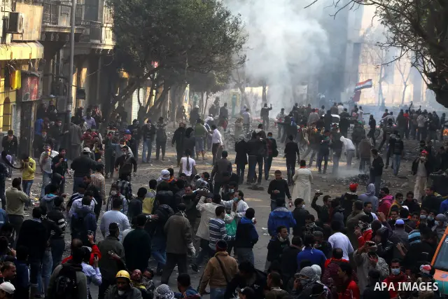 Egyptian protestors clash with riot police, not pictured, near Tahrir square in Cairo, Egypt, Wednesday, Nov. 23, 2011. Egyptian police are clashing with anti-government protesters for a fifth day in Cairo. Tens of thous...