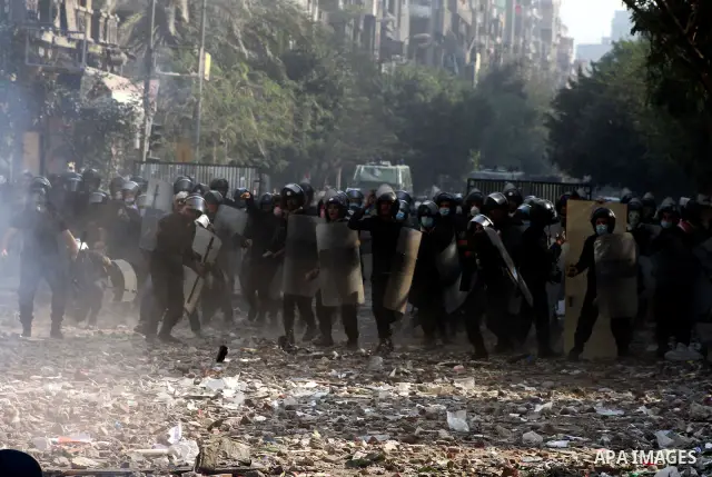 Egyptian riot police clash with protestors near Tahrir square in Cairo, Egypt, Wednesday, Nov. 23, 2011. Egyptian police are clashing with anti-government protesters for a fifth day in Cairo. Tens of thousands of protest...