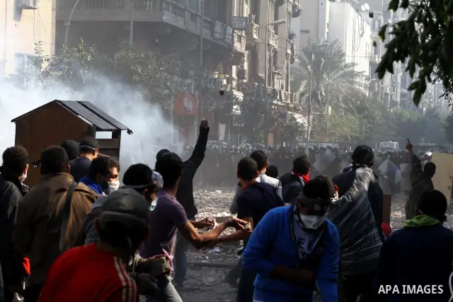 Egyptian riot police clash with protestors near Tahrir square in Cairo, Egypt, Wednesday, Nov. 23, 2011. Egyptian police are clashing with anti-government protesters for a fifth day in Cairo. Tens of thousands of protest...