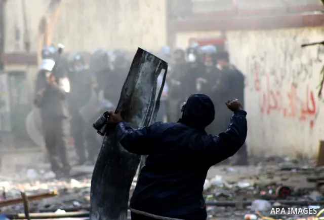 Egyptian riot police clash with protestors near Tahrir square in Cairo, Egypt, Wednesday, Nov. 23, 2011. Egyptian police are clashing with anti-government protesters for a fifth day in Cairo. Tens of thousands of protest...
