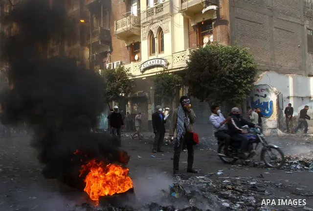 Egyptian protestors clash with riot police, not pictured, near Tahrir square in Cairo, Egypt, Wednesday, Nov. 23, 2011. Egyptian police are clashing with anti-government protesters for a fifth day in Cairo. Tens of thous...
