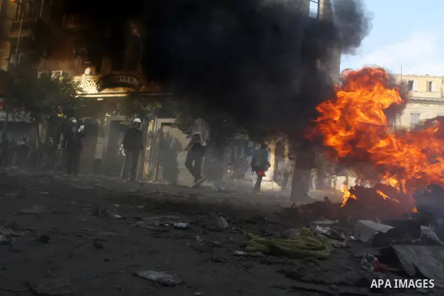 Egyptian protestors clash with riot police, not pictured, near Tahrir square in Cairo, Egypt, Wednesday, Nov. 23, 2011. Egyptian police are clashing with anti-government protesters for a fifth day in Cairo. Tens of thous...