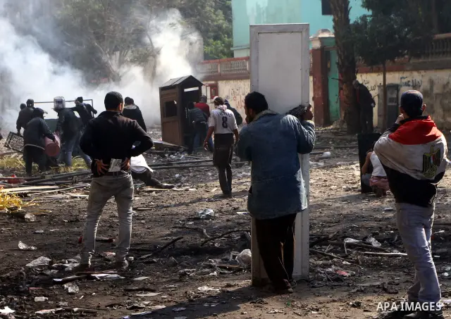 Egyptian protestors clash with riot police, not pictured, near Tahrir square in Cairo, Egypt, Wednesday, Nov. 23, 2011. Egyptian police are clashing with anti-government protesters for a fifth day in Cairo. Tens of thous...