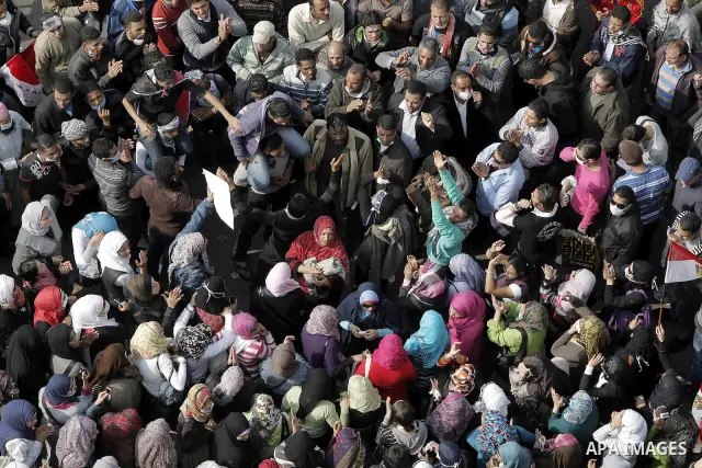 Protesters gather on Tahrir square as clashes against the anti-riot police are underway nearby in the street leading to the ministry of interior in Cairo, Egypt, Wednesday, Nov. 23, 2011. Tens of thousands of protesters...