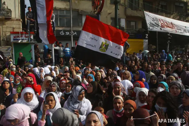 Protesters gather on Tahrir square as clashes against the anti-riot police are underway nearby in the street leading to the ministry of interior in Cairo, Egypt, Wednesday, Nov. 23, 2011. Tens of thousands of protesters...