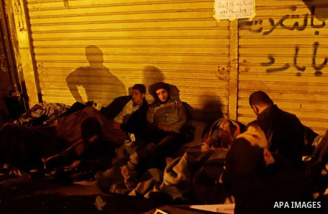 Egyptian protesters rest on Tahrir square in Cairo on November 23, 2011 on the fifth day of clashes with security forces. Photo by Ashraf Amra