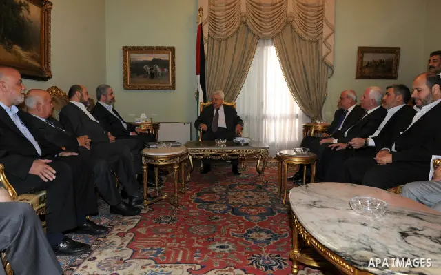 Palestinian president Mahmud Abbas speaks during a meeting with Hamas chief Khaled Meshaal and other top Fatah and Hamas officials in Cairo on November 24, 2011. Abbas and Meshaal hailed a new Palestinian "partnership" a...