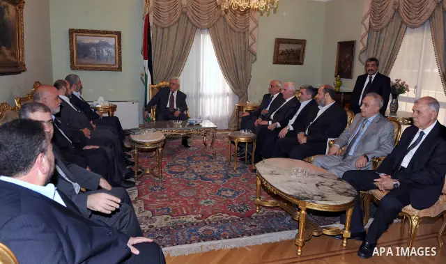 Palestinian president Mahmud Abbas speaks during a meeting with Hamas chief Khaled Meshaal and other top Fatah and Hamas officials in Cairo on November 24, 2011. Abbas and Meshaal hailed a new Palestinian "partnership" a...