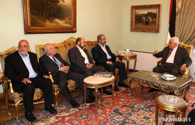 Palestinian president Mahmud Abbas meets with Hamas chief Khaled Meshaal and other top Fatah and Hamas officials in Cairo on November 24, 2011. Abbas and Meshaal hailed a new Palestinian "partnership" after talks to impl...