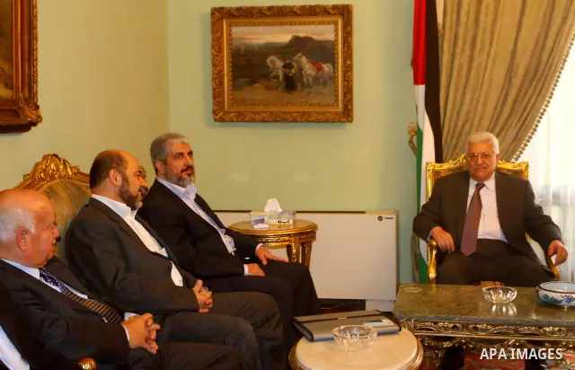 Palestinian president Mahmud Abbas speaks during a meeting with Hamas chief Khaled Meshaal and other top Fatah and Hamas officials in Cairo on November 24, 2011. Abbas and Meshaal hailed a new Palestinian "partnership" a...