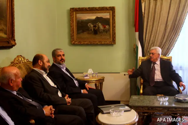 Palestinian president Mahmud Abbas speaks during a meeting with Hamas chief Khaled Meshaal and other top Fatah and Hamas officials in Cairo on November 24, 2011. Abbas and Meshaal hailed a new Palestinian "partnership" a...