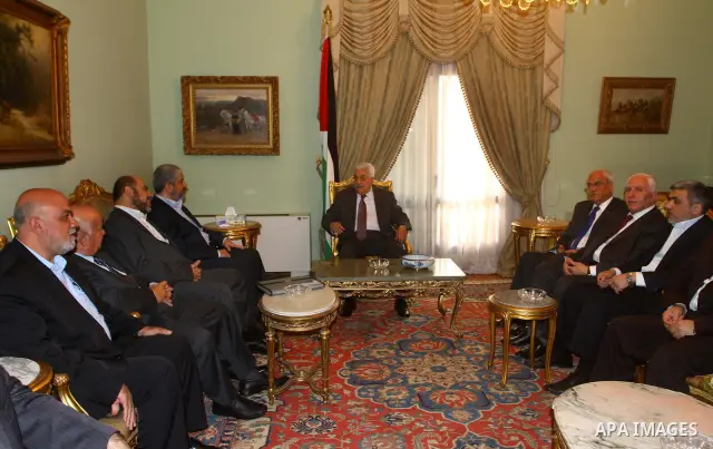 Palestinian president Mahmud Abbas speaks during a meeting with Hamas chief Khaled Meshaal and other top Fatah and Hamas officials in Cairo on November 24, 2011. Abbas and Meshaal hailed a new Palestinian "partnership" a...