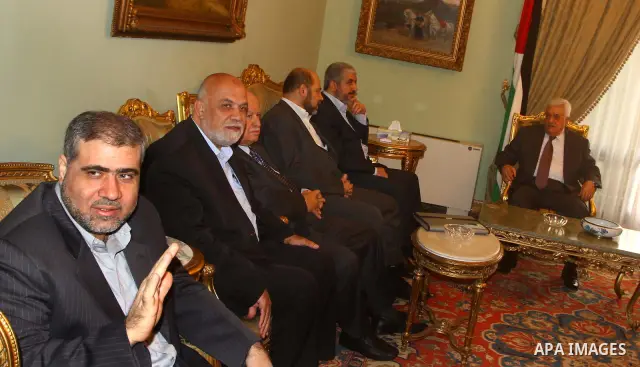 Palestinian president Mahmud Abbas speaks during a meeting with Hamas chief Khaled Meshaal and other top Fatah and Hamas officials in Cairo on November 24, 2011. Abbas and Meshaal hailed a new Palestinian "partnership" a...