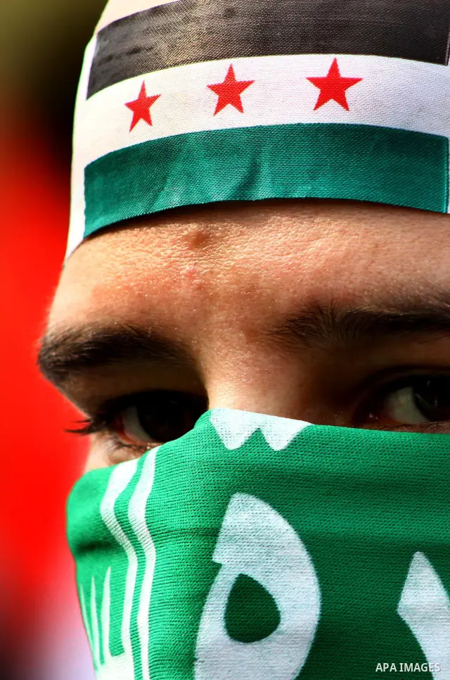 Pro-reform supporters protest outside the Arab League headquarters in the Egyptian capital Cairo, where a ministerial meeting on Syria was held on November 24, 2011. Arab foreign ministers have invited Syria to sign an a...