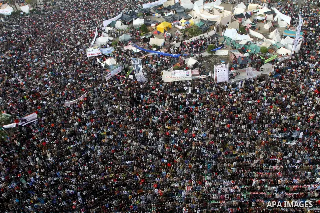Egyptian protesters pray during a mass rally in Cairo's landmark Tahrir square on November 25, 2011 to demand an end to the military rule. The head of the military council tasked 79-year-old Kamal al-Ganzuri, who was pre...