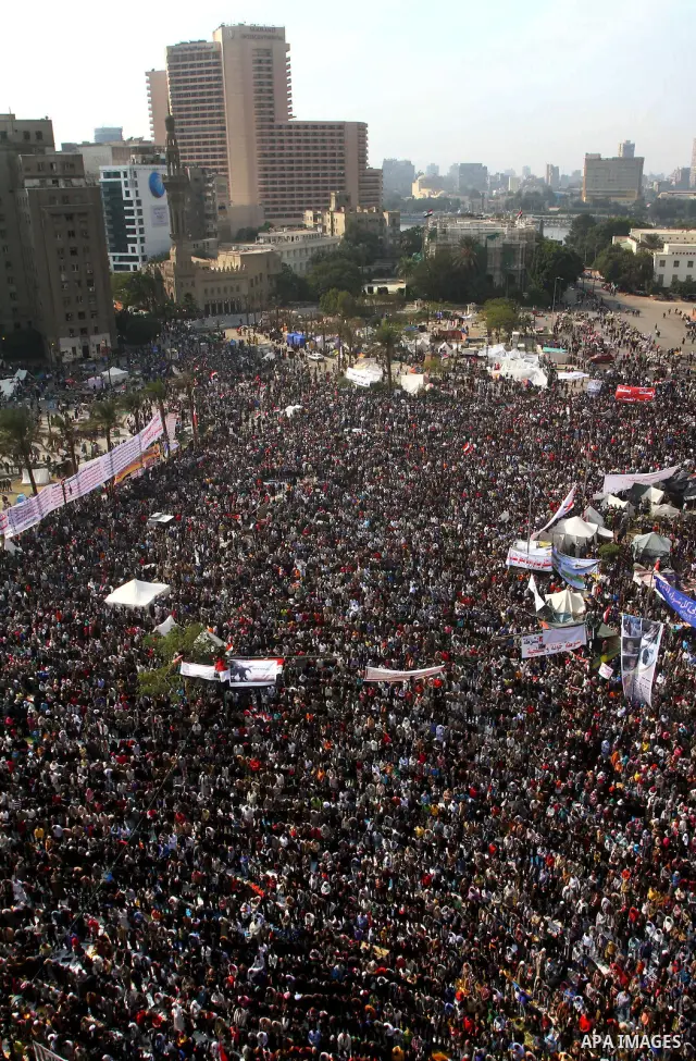 Egyptian protesters pray during a mass rally in Cairo's landmark Tahrir square on November 25, 2011 to demand an end to the military rule. The head of the military council tasked 79-year-old Kamal al-Ganzuri, who was pre...