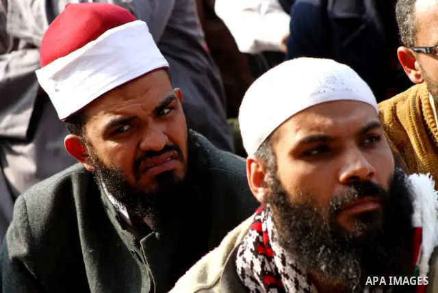 Egyptian protesters attend Friday prayers during a mass rally in Cairo's landmark Tahrir square on November 25, 2011 to demand an end to the military rule. The head of the military council tasked 79-year-old Kamal al-Gan...