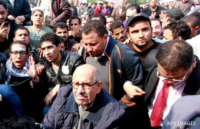 Pro-reform leader and Nobel peace laureate Mohamed El-Baradei is surrounded by protesters during his arrival for Friday prayers in Tahrir Square in Cairo, Egypt, 25 November 2011. The head of the military council tasked...