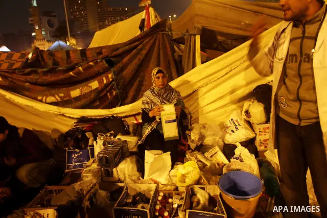 Thousands of Egyptian protesters attend a mass protest in Cairo's Tahrir square on November 24, 2011, as members of Egypt's ruling military council rejected calls to step down immediately, saying it would amount to a "be...