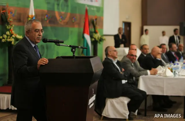 Palestinian Prime Minister Salam Fayyad participate in the opening of the Expotech gallery of information technology in the West Bank of Ramallah, on Nov. 27, 2011. Photo by Mustafa Abu Dayeh