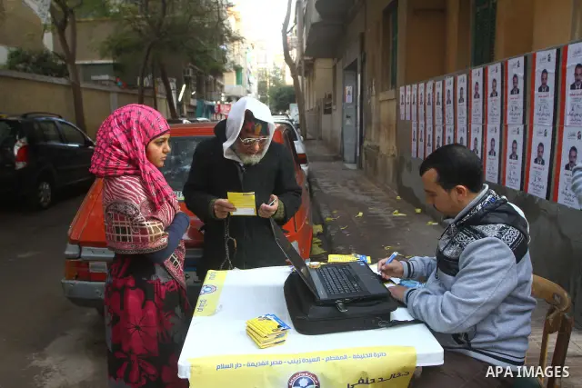 Egyptian voters queue at a polling station in the Manial neighbourhood of Cairo on November 28, 2011. Egyptians began voting in the first elections since the fall of autocrat Hosni Mubarak who was ousted in February in o...
