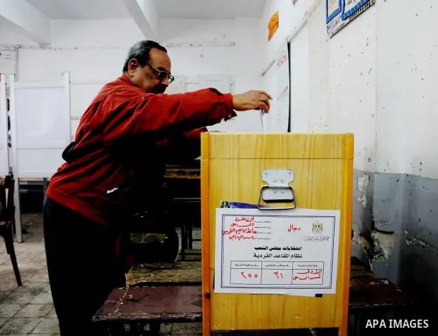 A Egyptian man casts his vote at a polling station in the Manial neighbourhood of Cairo on November 28, 2011. Egyptians began voting in the first elections since the fall of autocrat Hosni Mubarak who was ousted in Febru...