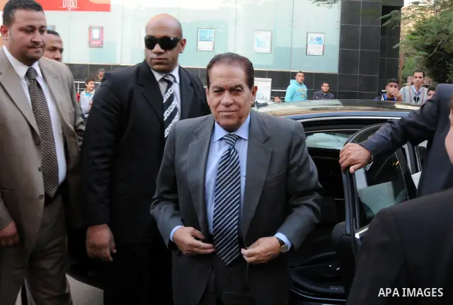 Egyptian Premier Kamal al-Ganzuri casts his ballot at a polling station in Cairo's Heliopolis district on November 28, 2011 as Egyptians flocked to the polls for a first post-revolution election, making a mostly orderly...