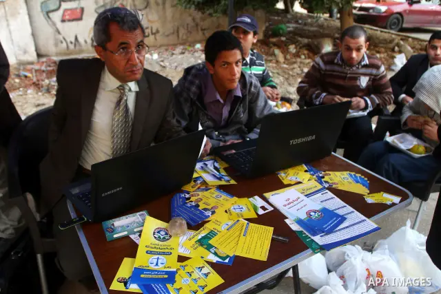 A Egyptian man casts his vote at a polling station in the Manial neighbourhood of Cairo on November 28, 2011. Egyptians began voting in the first elections since the fall of autocrat Hosni Mubarak who was ousted in Febru...