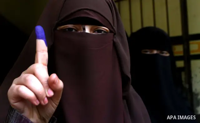Egyptians cast their ballot at a parliamentary polling station in Cairo on November 29, 2011. Egypt hailed the start of its first post-revolution election as a triumph for democracy as more voters headed to the polls, bo...