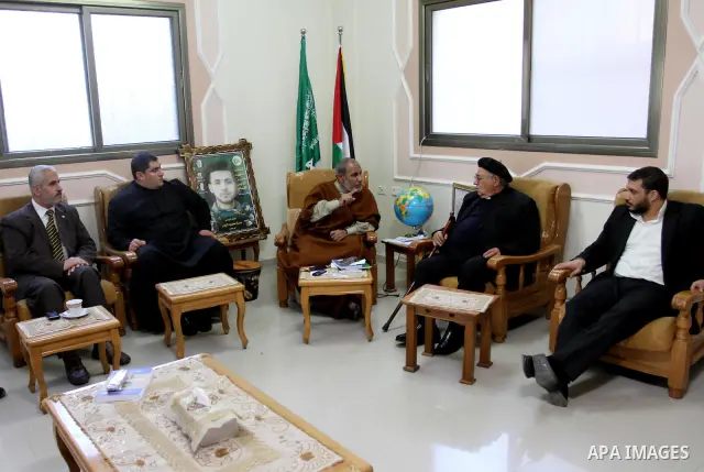 A Palestinian Hamas leader, Mahmoud al-Zahar meets with Manuel Musalam, the member of Consortium of Independent Palestinians (CIP), in Gaza city on Nov. 29,2011. Photo by Mohammed Asad
