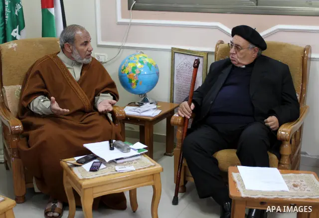 A Palestinian Hamas leader, Mahmoud al-Zahar meets with Manuel Musalam, the member of Consortium of Independent Palestinians (CIP), in Gaza city on Nov. 29,2011. Photo by Mohammed Asad