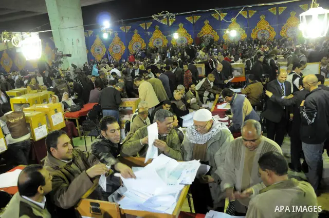 Election workers count ballots for the parliamentary elections in Luxor, Egypt, Tuesday, Nov. 29, 2011. Egypt's military rulers are taking credit for the strong turnout in the country's first parliamentary elections sinc...