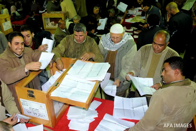 Election workers count ballots for the parliamentary elections in Luxor, Egypt, Tuesday, Nov. 29, 2011. Egypt's military rulers are taking credit for the strong turnout in the country's first parliamentary elections sinc...