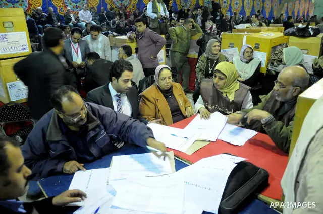 Election workers count ballots for the parliamentary elections in Luxor, Egypt, Tuesday, Nov. 29, 2011. Egypt's military rulers are taking credit for the strong turnout in the country's first parliamentary elections sinc...